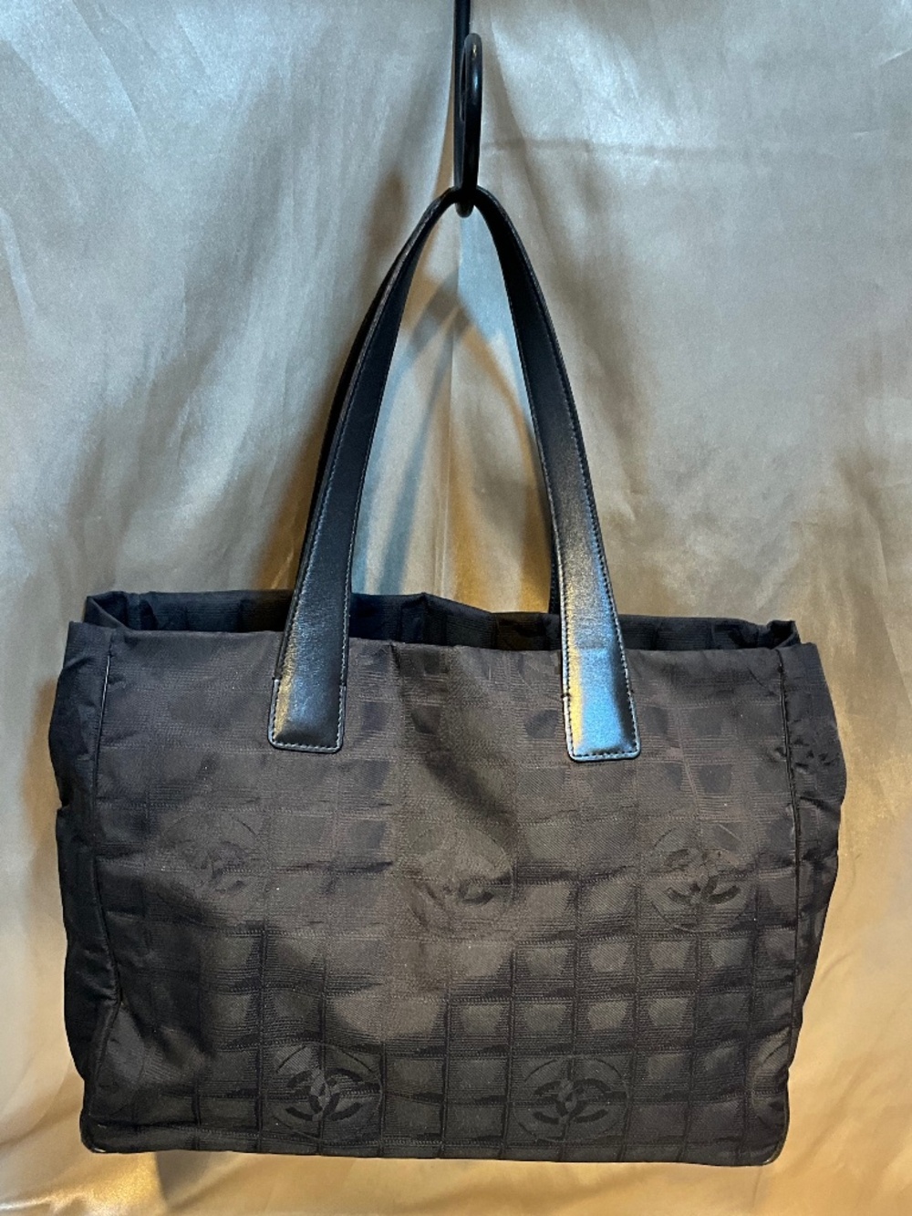 Chanel black, signature print, nylon tote.     H5B